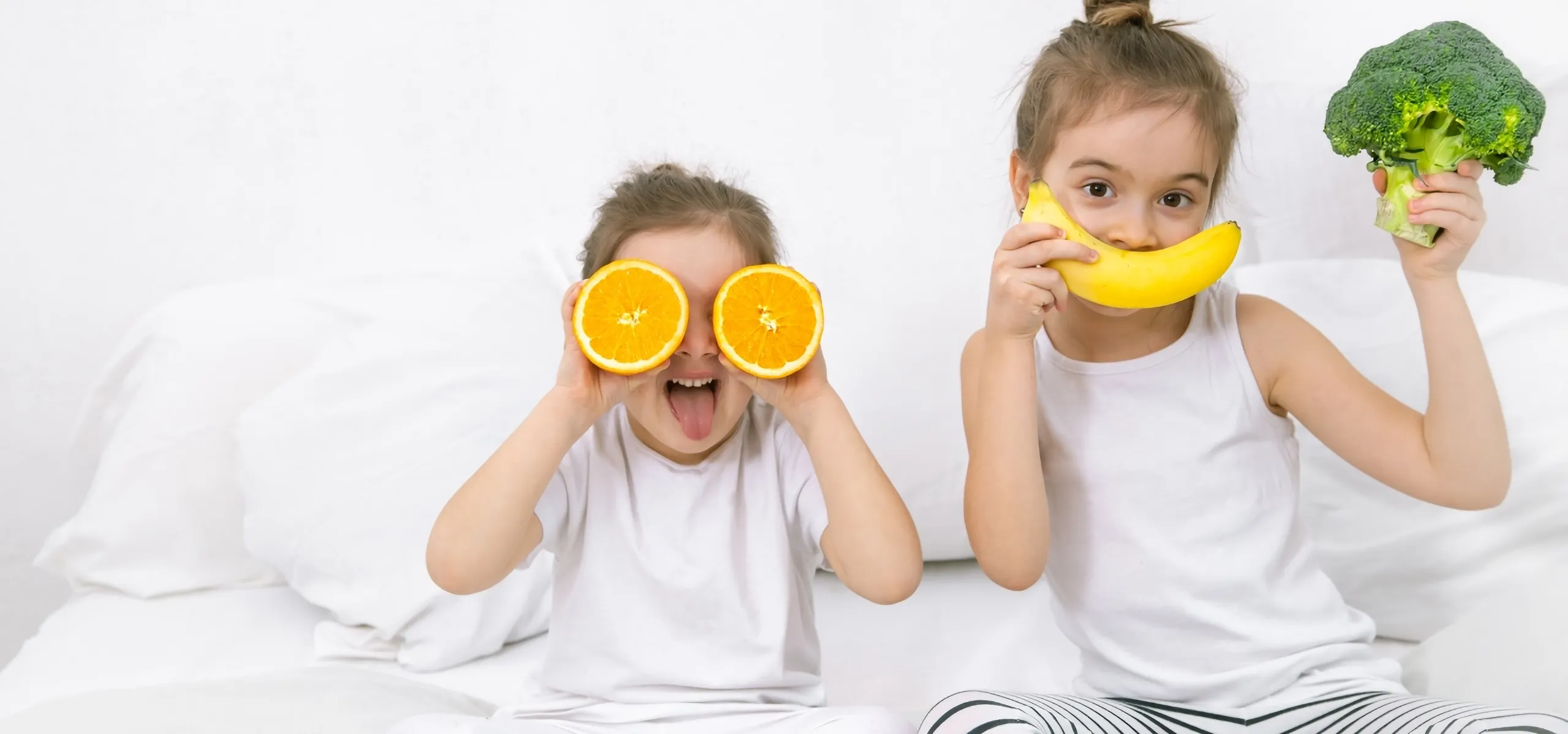 children tasting fruits