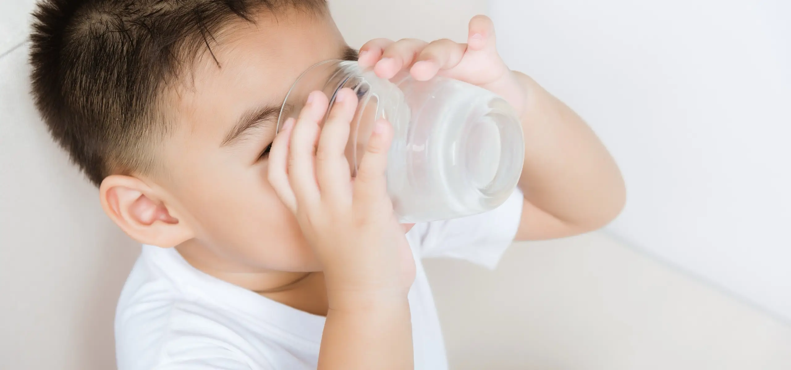 kid drinking glass of milk